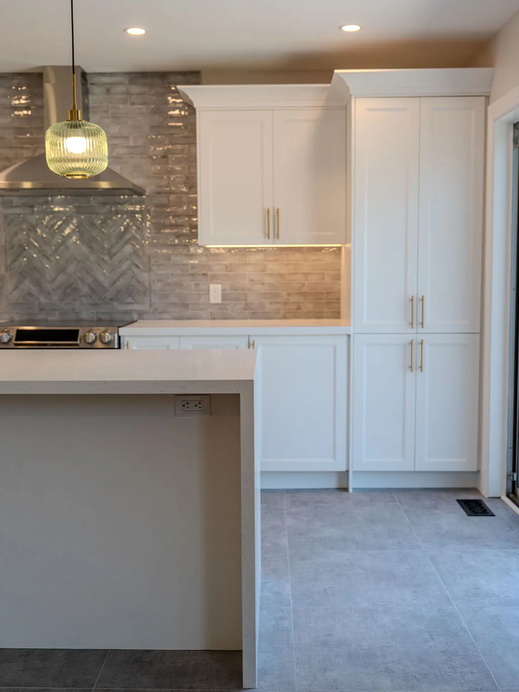 Professional installer measuring and aligning custom kitchen cabinets, emphasizing installation accuracy
