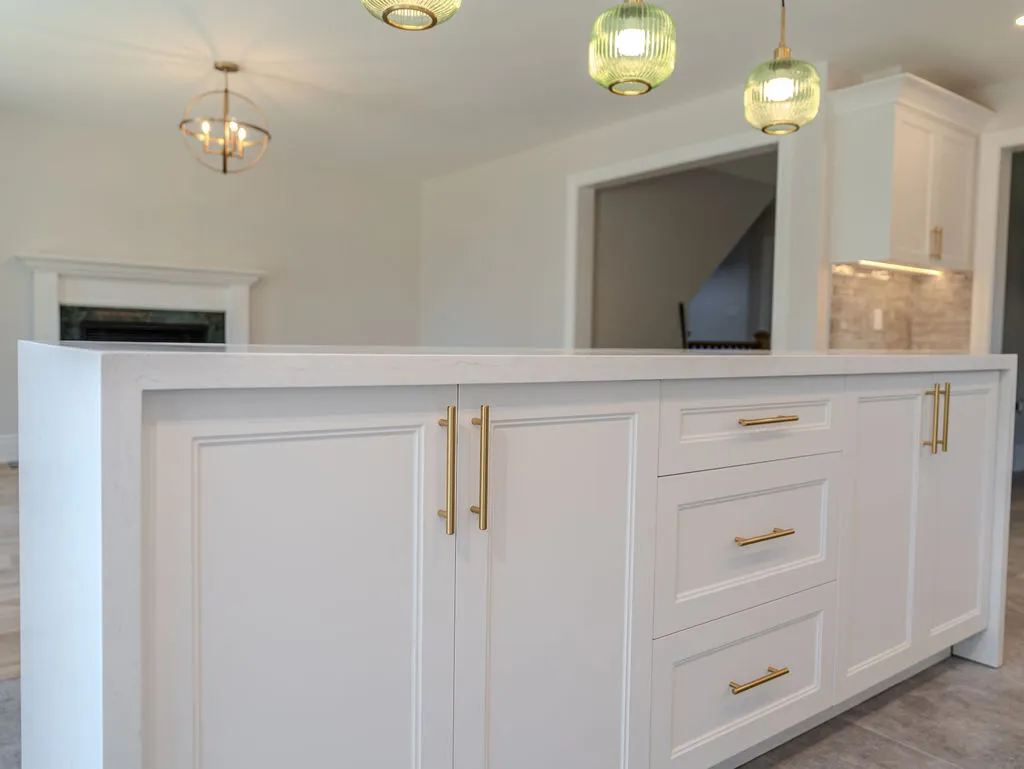 Display of kitchen cabinetry, countertops, and lighting samples