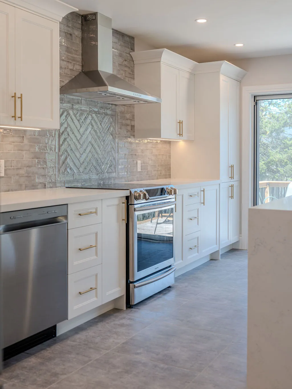 Professional installer working on kitchen cabinet installation in a modern kitchen