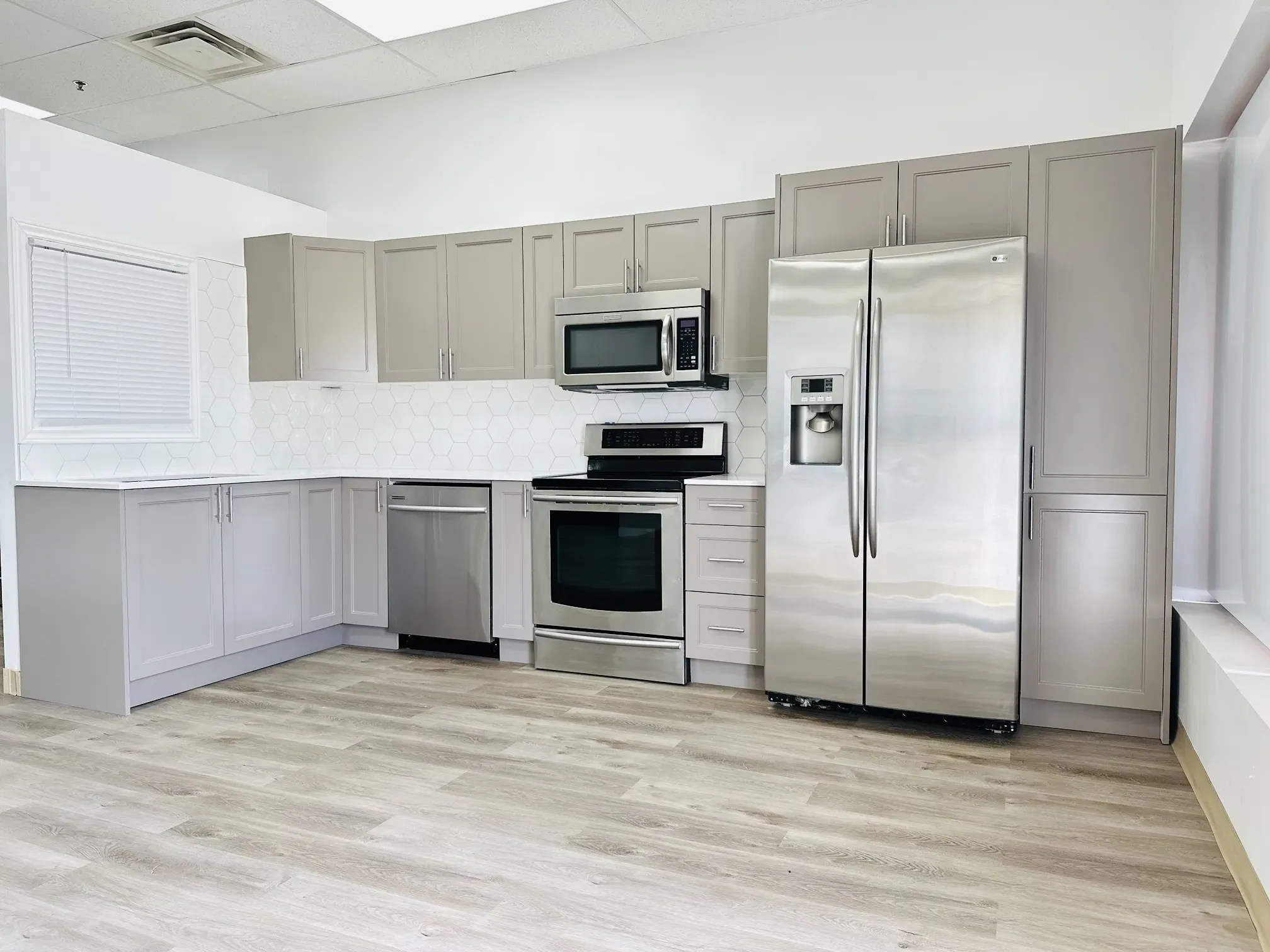 Materials used in custom kitchen cabinets: wood, MDF, and quartz accents