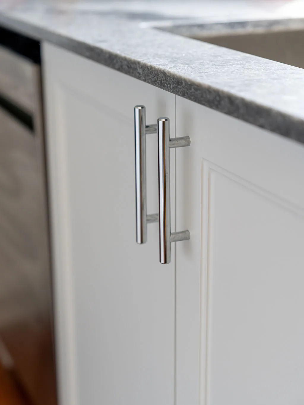 Close-up of quartz, granite, and laminate countertop materials side by side