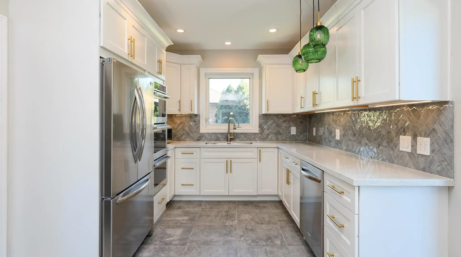 The galley layout arranges two cabinet rows on either side of the work area